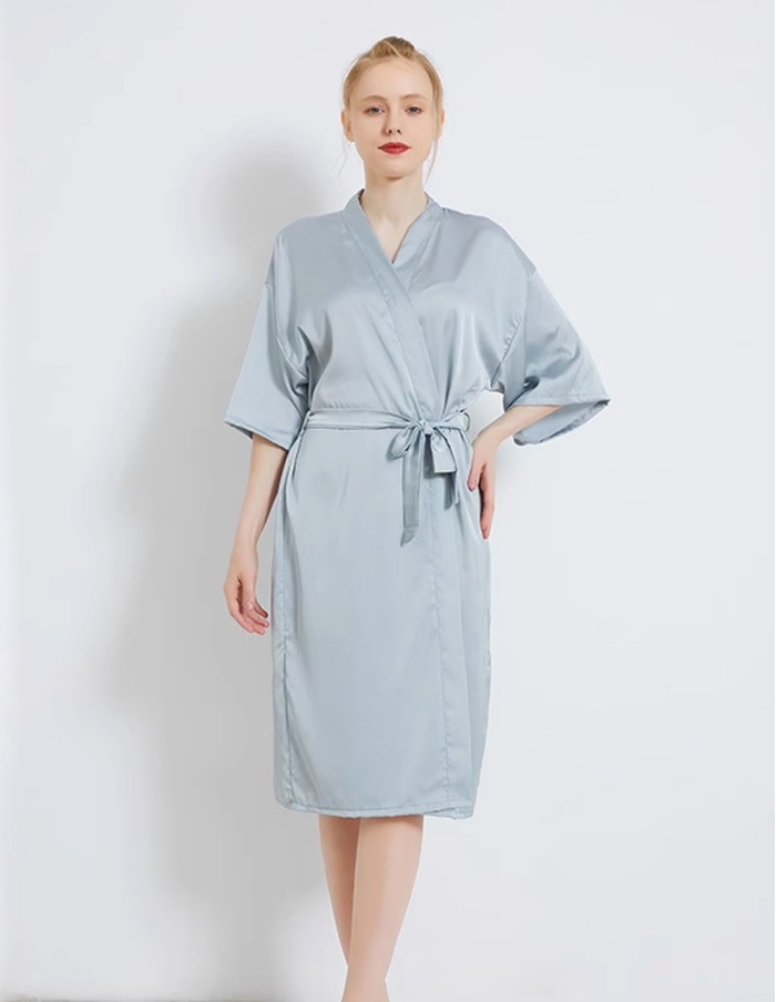 Dusty blue robes with gold 'bridesmaid' embroidery